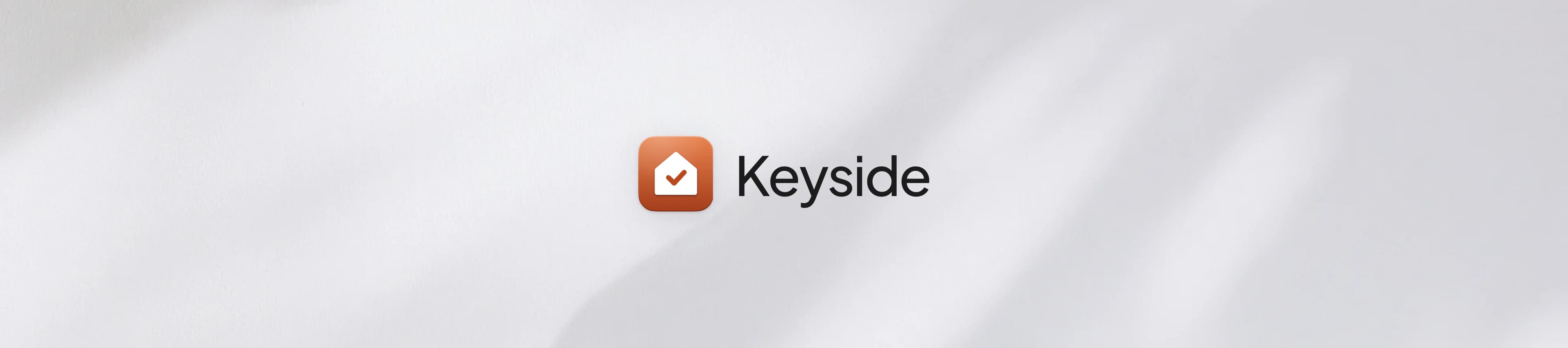 Keyside wordmark and app tile on white with soft shadows